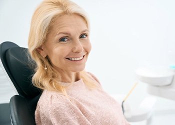 a patient smiling with new dental implants