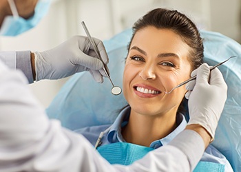 a patient smiling during a dental examination