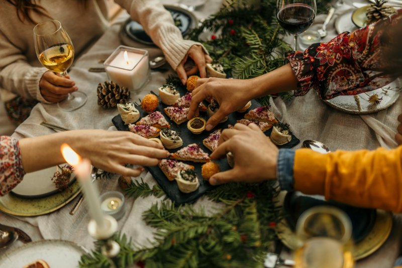 Patient with good oral health enjoying snacks at holiday party