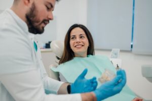 Woman smiling after her full smile reconstruction